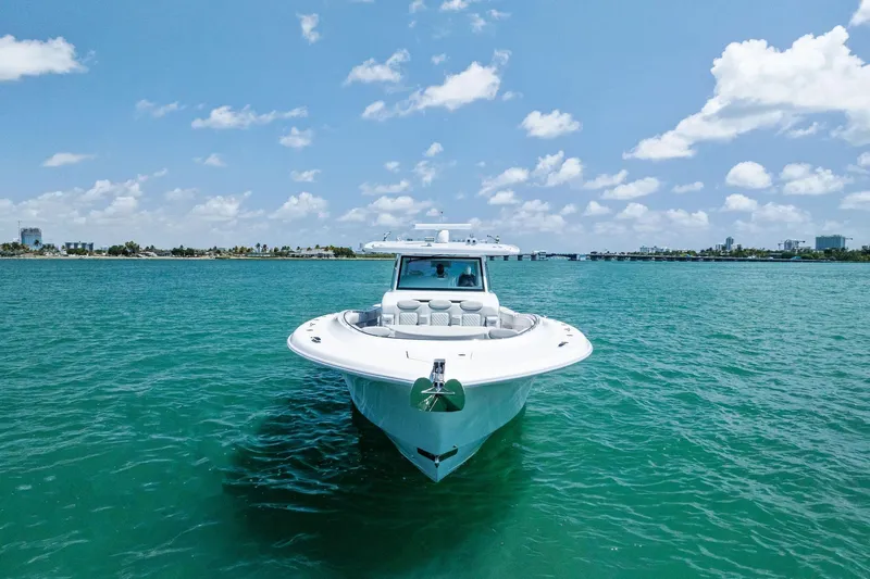  Yacht Photos Pics 2025 HCB 56 Suenos GIX yacht on clear blue water under a sunny sky.