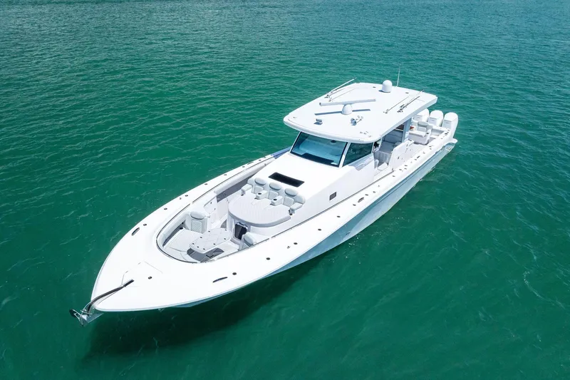  Yacht Photos Pics 2025 HCB 56 Suenos GIX luxury yacht on clear turquoise water.