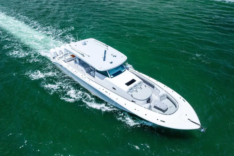  Yacht Photos Pics 2025 HCB 56 Suenos GIX luxury yacht cruising on open water.