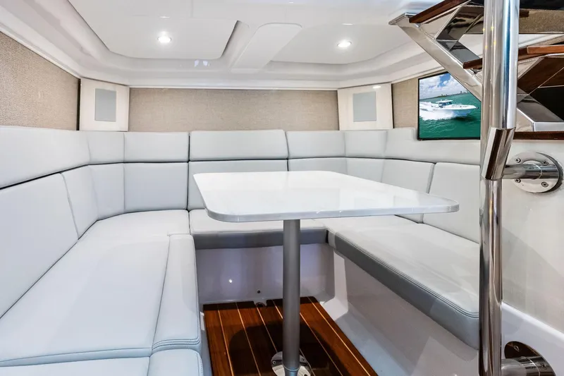  Yacht Photos Pics Luxurious interior of 2025 HCB 56 Suenos GIX yacht with elegant seating and table.