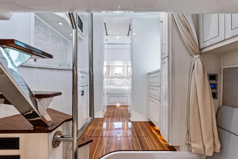  Yacht Photos Pics Luxurious interior of 2025 HCB 56 Suenos GIX yacht with elegant wood flooring.