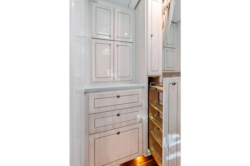  Yacht Photos Pics Luxurious cabinetry in the 2025 HCB 56 Suenos GIX yacht interior, featuring sleek storage solutions.