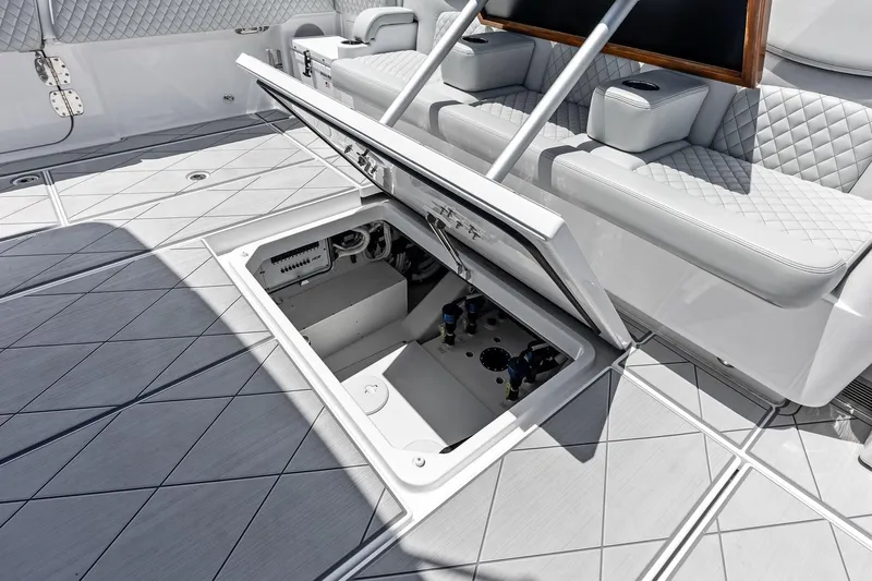  Yacht Photos Pics Open storage compartment on 2025 HCB 56 Suenos GIX yacht deck, showcasing luxury design.