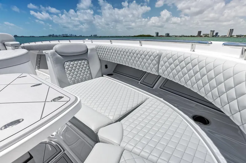  Yacht Photos Pics Luxurious seating on 2025 HCB 56 Suenos GIX yacht with quilted upholstery and ocean view.