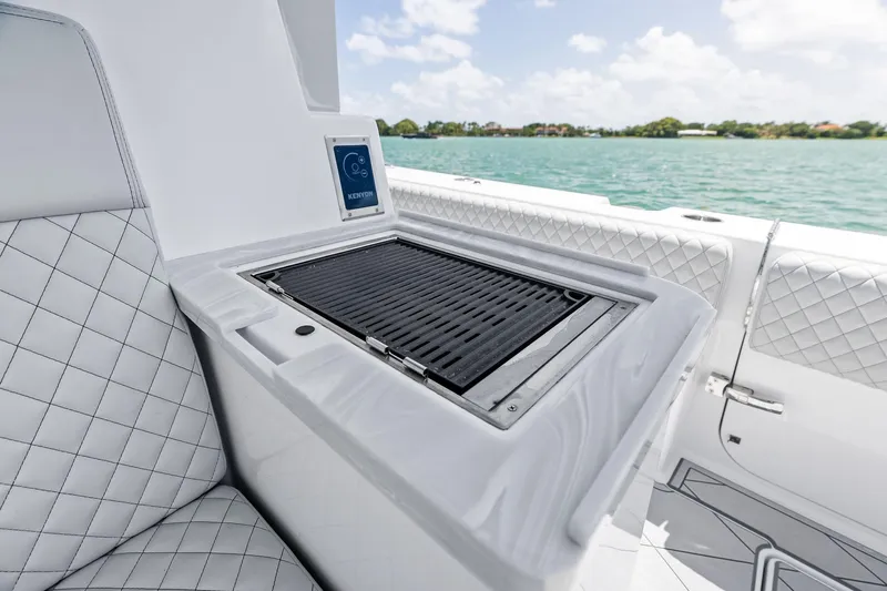 Yacht Photos Pics Luxury grill on 2025 HCB 56 Suenos GIX yacht, overlooking serene waters.