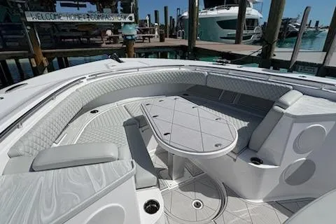  Yacht Photos Pics Luxurious seating area on 2025 HCB 56 Suenos GIX yacht, docked at marina.