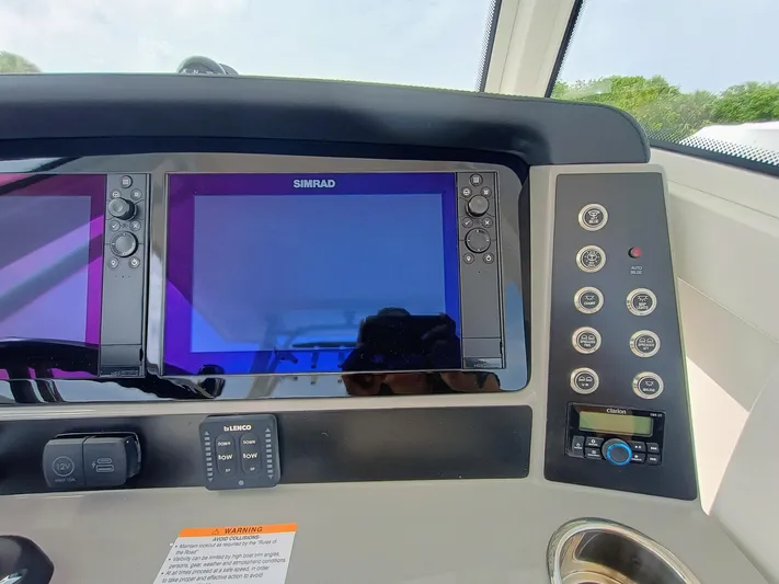 270-152 Yacht Photos Pics 2025 Robalo R270 Center Console dashboard with Simrad displays and control panel.