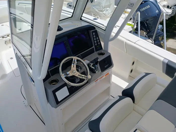 270-152 Yacht Photos Pics 2025 Robalo R270 Center Console boat interior with modern steering and dual seating.