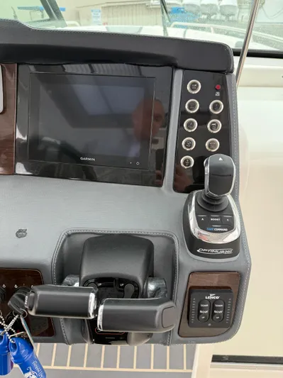  Yacht Photos Pics Control panel of 2020 Chaparral 300 OSX boat with joystick and display screen.