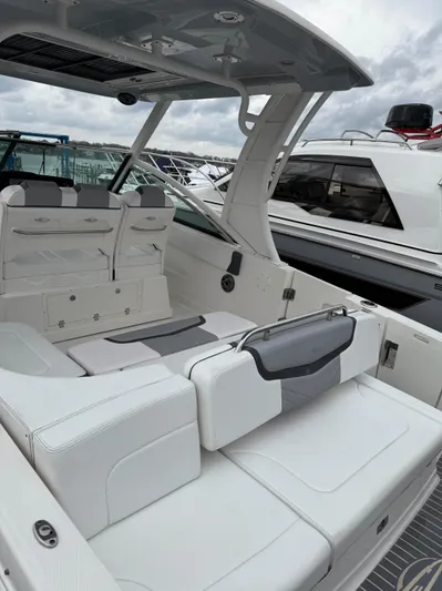  Yacht Photos Pics 2020 Chaparral 300 OSX boat with sleek white seating and modern design.