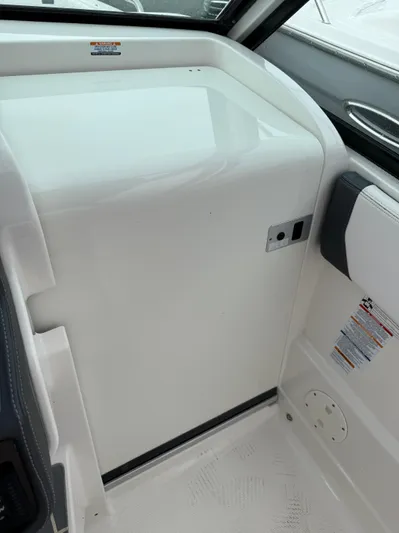  Yacht Photos Pics 2020 Chaparral 300 OSX interior detail, featuring sleek white paneling and modern design elements.