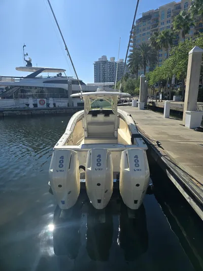  Yacht Photos Pics 2024 Scout 355 LXF boat docked with triple 400 V8 engines.