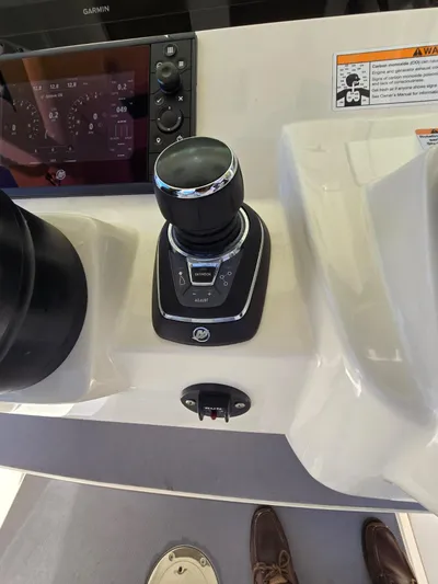  Yacht Photos Pics 2024 Scout 355 LXF boat control panel with joystick and display screen.