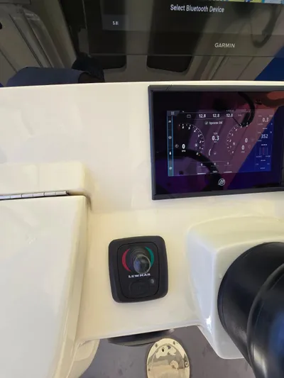  Yacht Photos Pics 2024 Scout 355 LXF boat dashboard with Garmin display and controls.