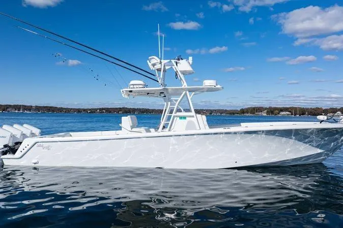  Yacht Photos Pics 2016 SeaVee 390Z boat on calm water under a clear blue sky.