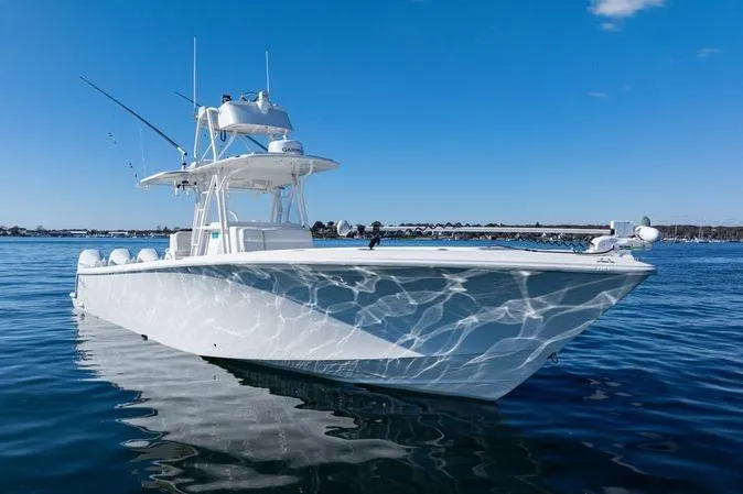 Yacht Photos Pics 2016 SeaVee 390Z boat on calm water under clear blue sky.