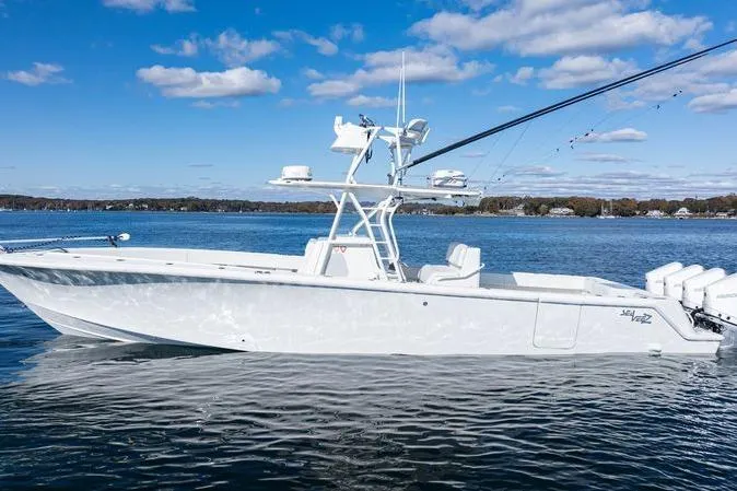  Yacht Photos Pics 2016 SeaVee 390Z boat on calm water under a clear blue sky.