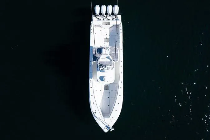  Yacht Photos Pics Overhead view of 2016 SeaVee 390Z boat with four engines on dark water.