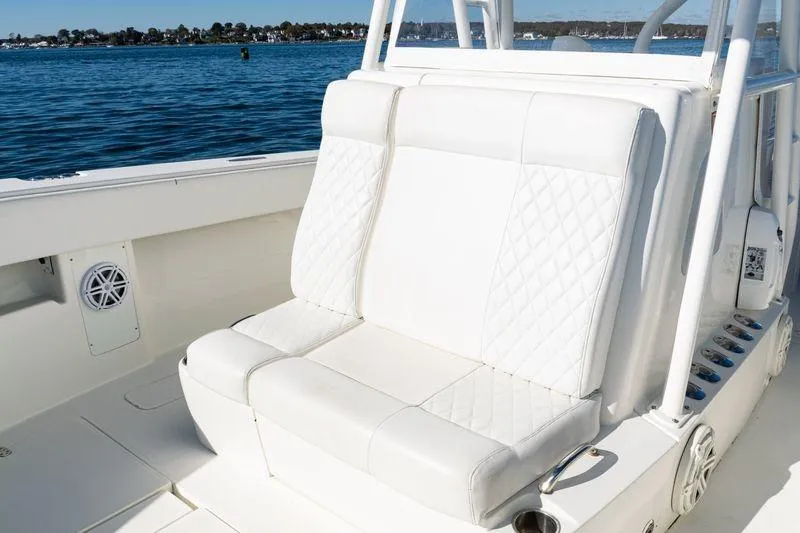  Yacht Photos Pics 2016 SeaVee 390Z boat with white cushioned seating, on a calm blue sea.