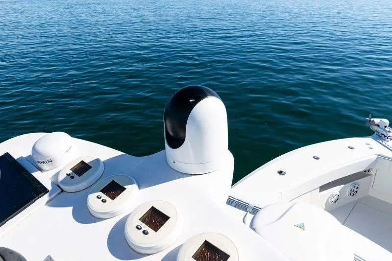  Yacht Photos Pics 2016 SeaVee 390Z boat dashboard with navigation equipment on calm water.