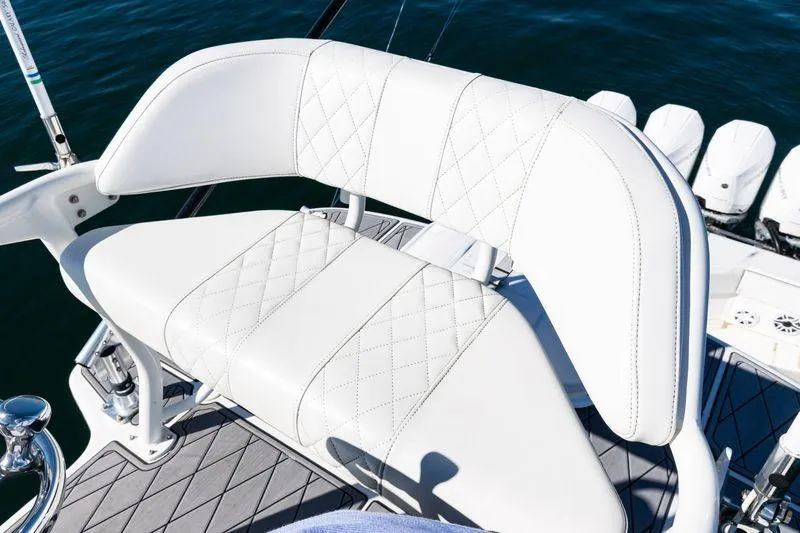  Yacht Photos Pics 2016 SeaVee 390Z boat with white cushioned seating and diamond stitching detail.