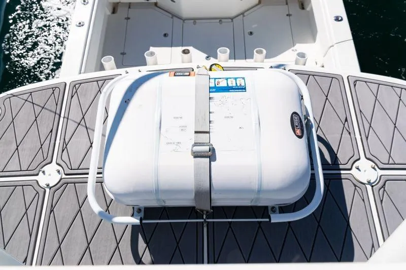  Yacht Photos Pics 2016 SeaVee 390Z boat deck with secured life raft, ocean in background.