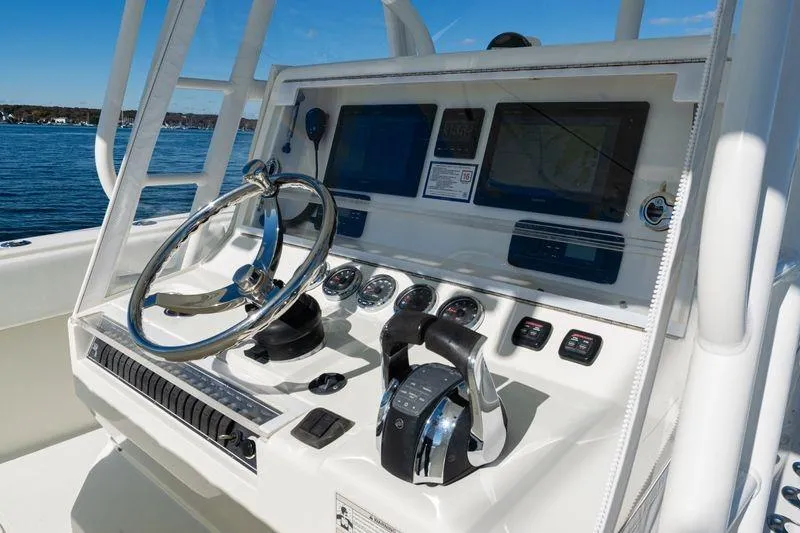  Yacht Photos Pics 2016 SeaVee 390Z boat dashboard with steering wheel and navigation controls.