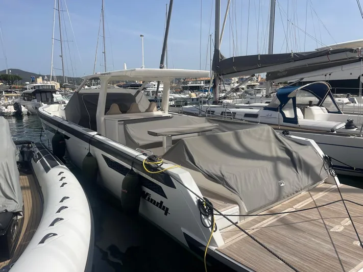  Yacht Photos Pics 2022 Windy SR 44 BLACKHAWK yacht docked in a marina, covered and ready for sailing.
