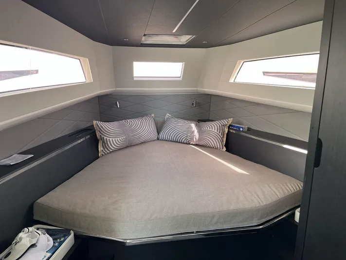  Yacht Photos Pics Luxurious cabin interior of 2022 Windy SR 44 BLACKHAWK yacht with modern bedding.