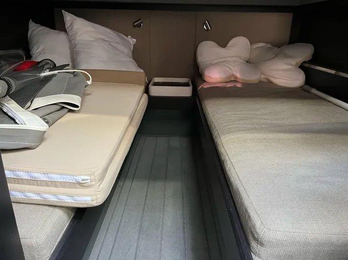 Yacht Photos Pics Cabin interior of 2022 Windy SR 44 BLACKHAWK with twin beds and pillows.