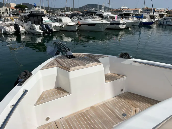  Yacht Photos Pics 2022 Windy SR 44 BLACKHAWK yacht docked in a marina with other boats.