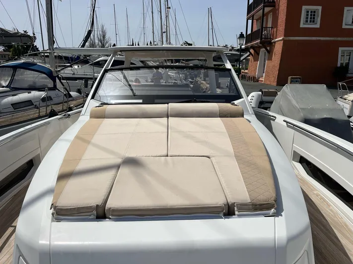  Yacht Photos Pics Luxurious 2022 Windy SR 44 BLACKHAWK yacht with spacious sunbathing deck at marina.