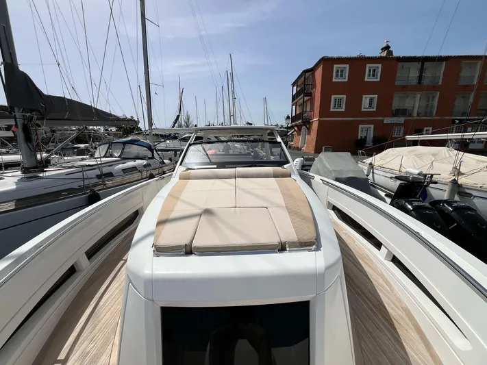  Yacht Photos Pics 2022 Windy SR 44 BLACKHAWK yacht docked in marina, featuring sleek design and sunbathing area.