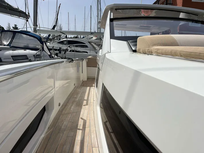  Yacht Photos Pics 2022 Windy SR 44 BLACKHAWK yacht docked, showcasing sleek design and spacious deck.