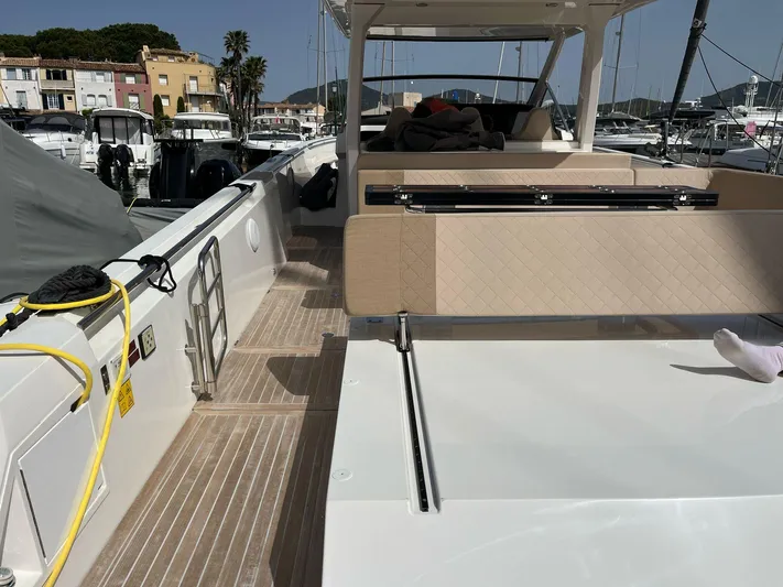  Yacht Photos Pics Luxurious 2022 Windy SR 44 BLACKHAWK yacht docked at marina, featuring spacious deck and seating.