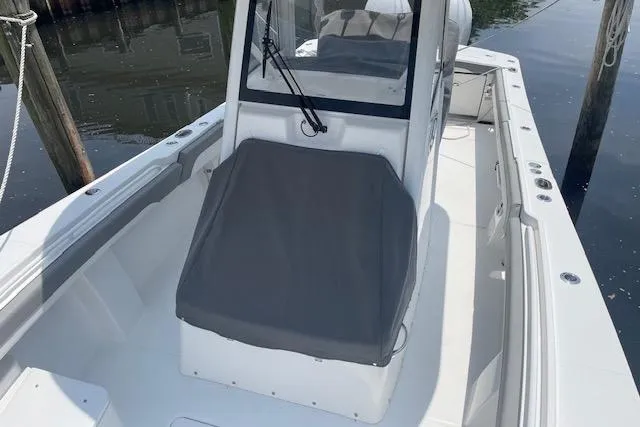  Yacht Photos Pics 2024 Regulator 28 boat with sleek design, docked in calm waters.