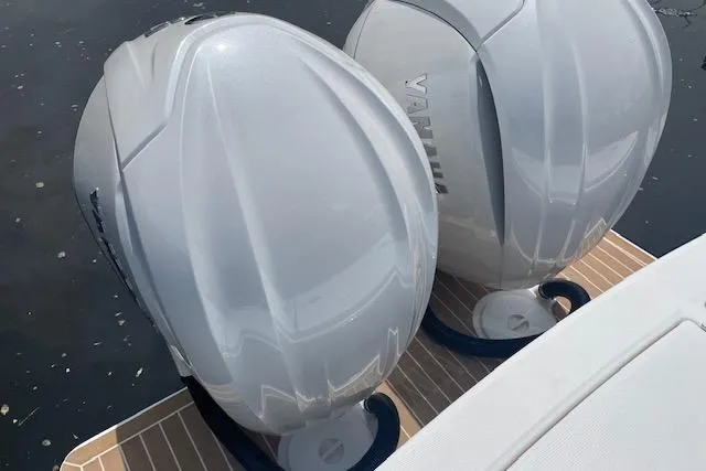  Yacht Photos Pics Twin Yamaha outboard engines on a 2024 Regulator 28 boat, docked on water.