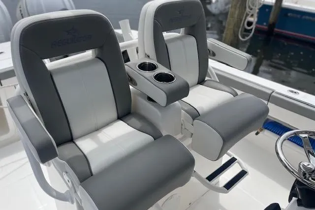  Yacht Photos Pics 2024 Regulator 28 boat seats with cup holders, featuring sleek gray and white design.