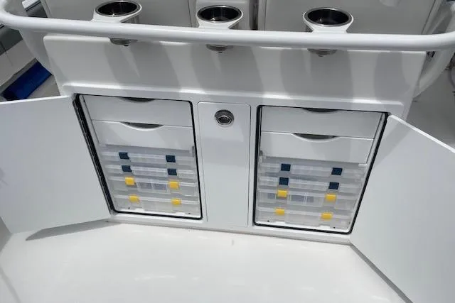  Yacht Photos Pics 2024 Regulator 28 boat storage compartments with organized tackle boxes and cup holders.