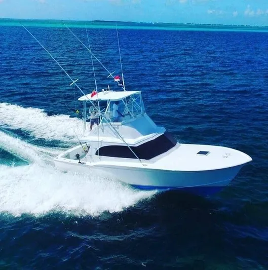 Constellation Yacht Photos Pics 1984 Sunny Briggs Custom Carolina boat cruising on open water.
