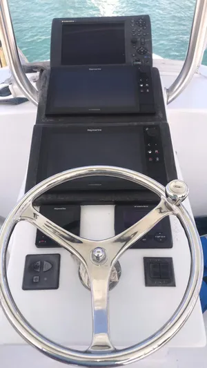 Constellation Yacht Photos Pics 1984 Sunny Briggs Custom Carolina boat helm with modern navigation equipment.