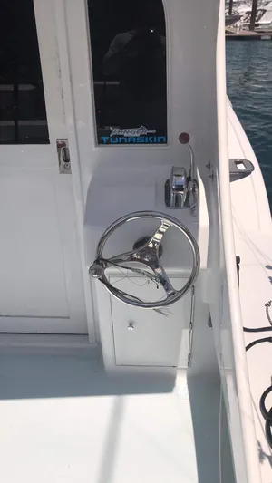 Constellation Yacht Photos Pics 1984 Sunny Briggs Custom Carolina boat helm with steering wheel and throttle controls.