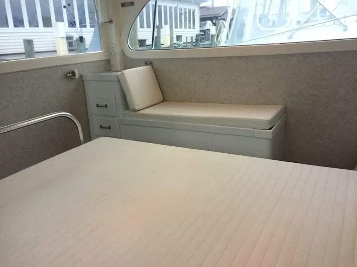 Constellation Yacht Photos Pics Interior of 1984 Sunny Briggs Custom Carolina boat with cushioned seating and storage.