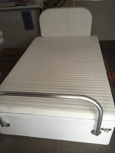 Constellation Yacht Photos Pics 1984 Sunny Briggs Custom Carolina boat bed with white cushioned mattress.