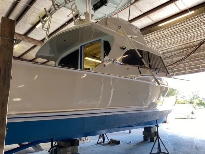 Constellation Yacht Photos Pics 1984 Sunny Briggs Custom Carolina boat in a warehouse for maintenance.