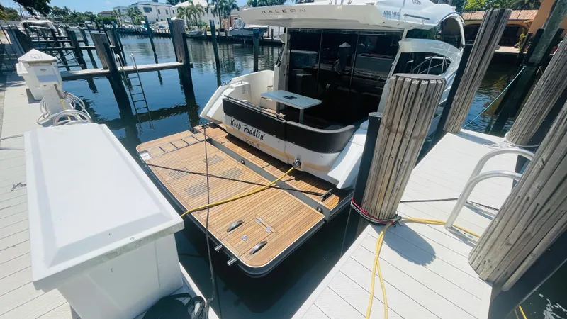 Keep Paddlin' Yacht Photos Pics Galeon 430 HTC 2019 at dock with wooden platform.