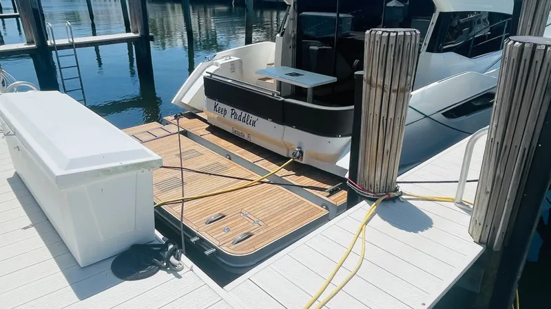 Keep Paddlin' Yacht Photos Pics 2019 Galeon 430 HTC docked with wooden deck.