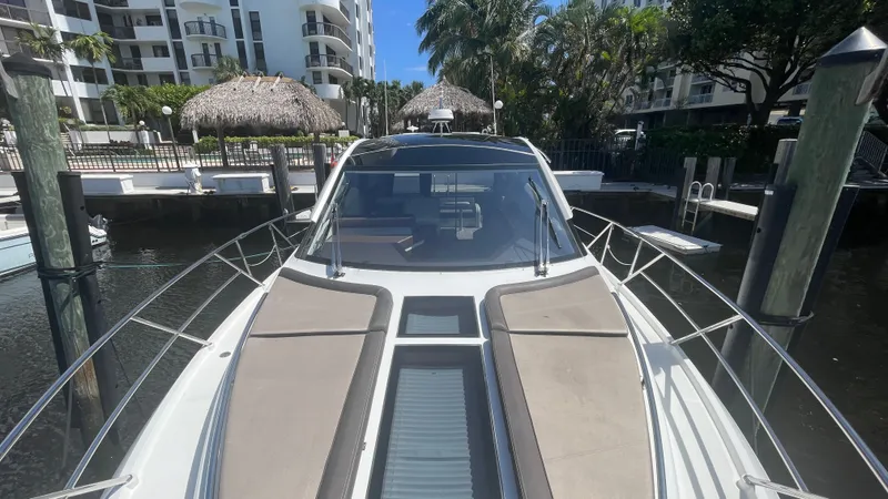 Keep Paddlin' Yacht Photos Pics 2019 Galeon 430 HTC yacht docked, surrounded by palm trees.