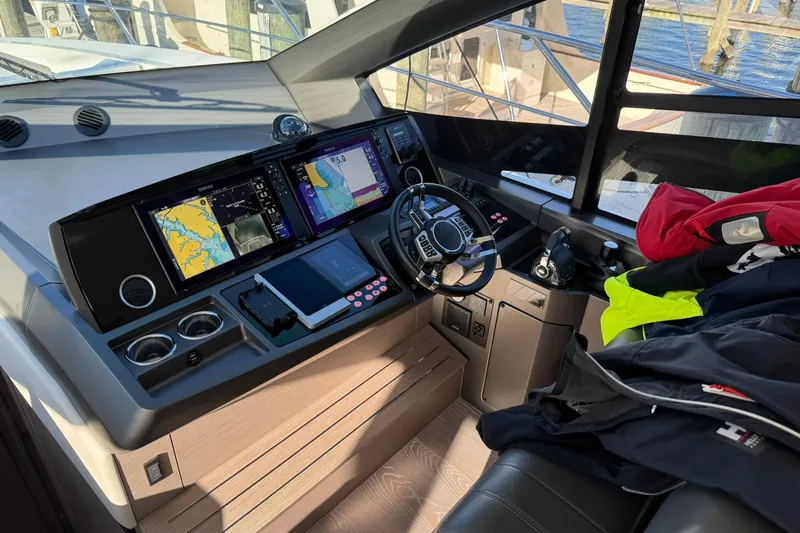 Yacht Photos Pics Cockpit of 2022 Sunseeker Manhattan 55 yacht with navigation screens and controls.