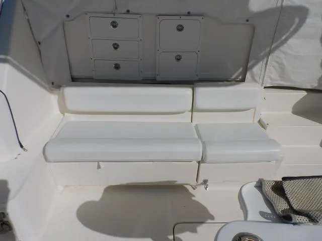 Mad Hatter Yacht Photos Pics 1997 Tiara Yachts Open interior seating with storage compartments.